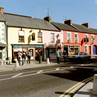 A row of painted shopfronts on the main street in Adare, County Limerick