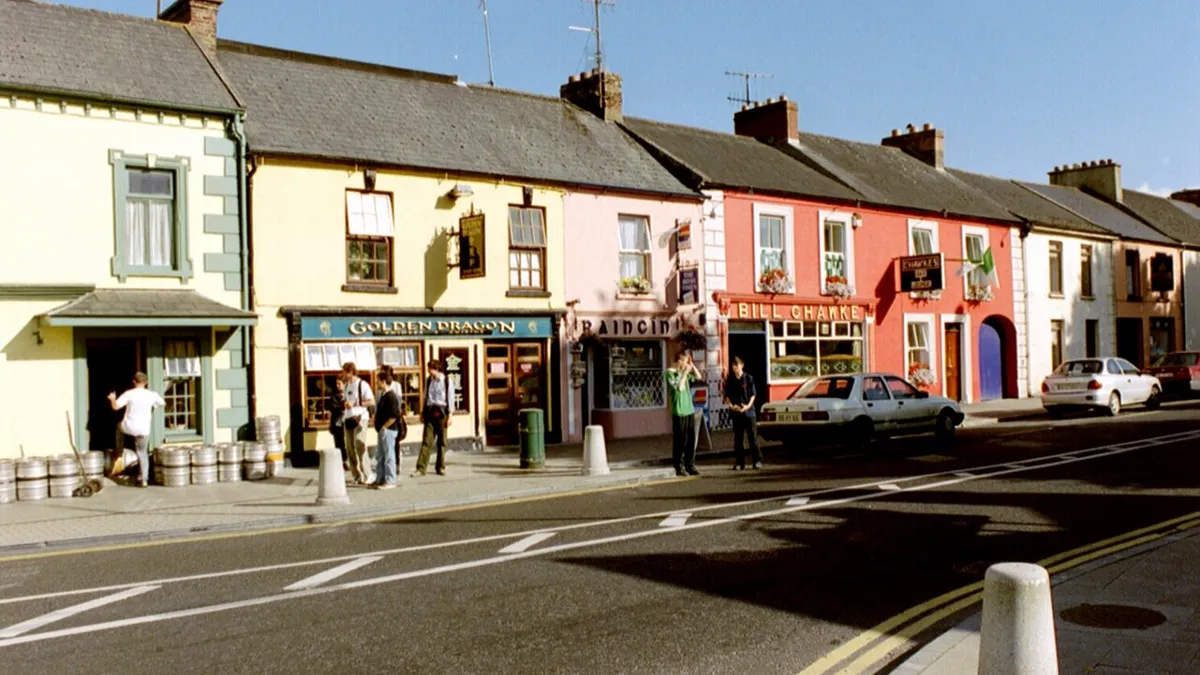 A row of painted shopfronts on the main street in Adare, County Limerick