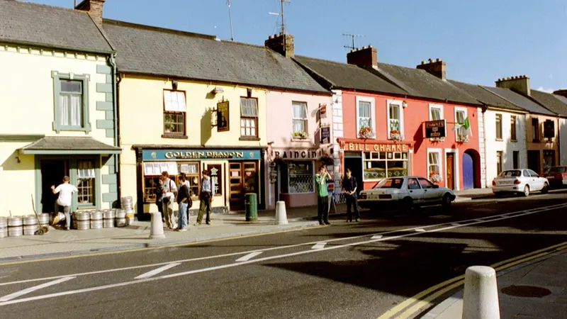 A row of painted shopfronts on the main street in Adare, County Limerick