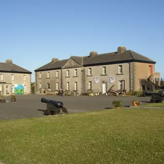 The barrack buildings and cannon in the square at Duncannon Fort