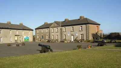 The barrack buildings and cannon in the square at Duncannon Fort