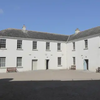 The white walls of the courtyard buildings inside Dungarvan Castle