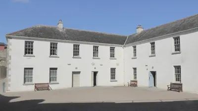 The white walls of the courtyard buildings inside Dungarvan Castle