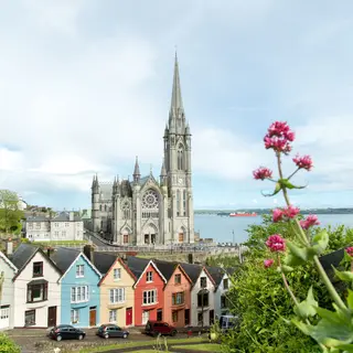 St Colman's Cathedral above the coloured houses on the Cobh waterfront