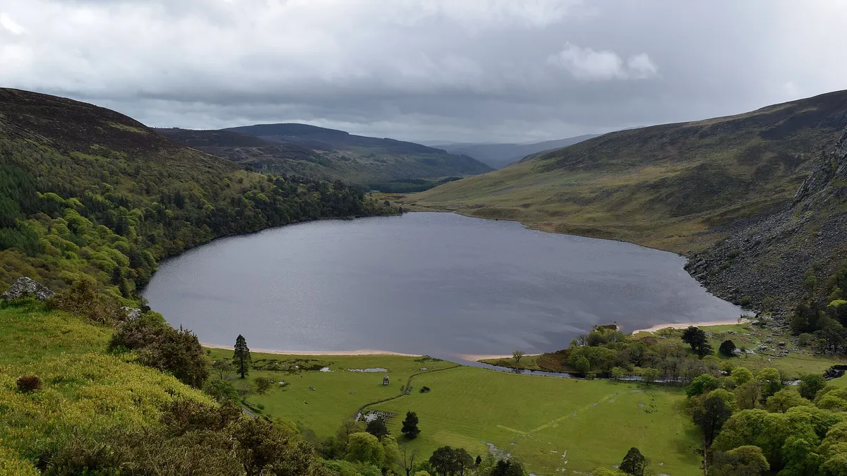 Lough Tay lying dark between the Wicklow hills