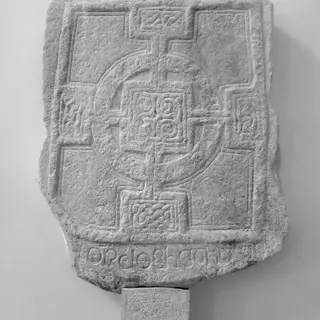 A carved interlace panel on the high cross at Durrow