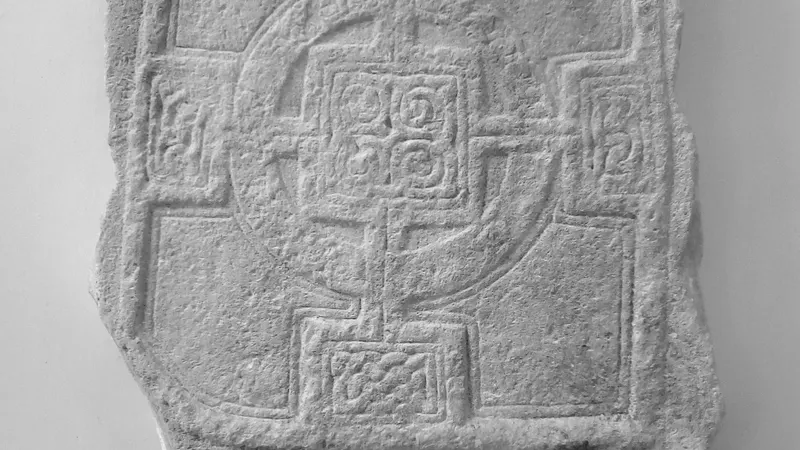 A carved interlace panel on the high cross at Durrow