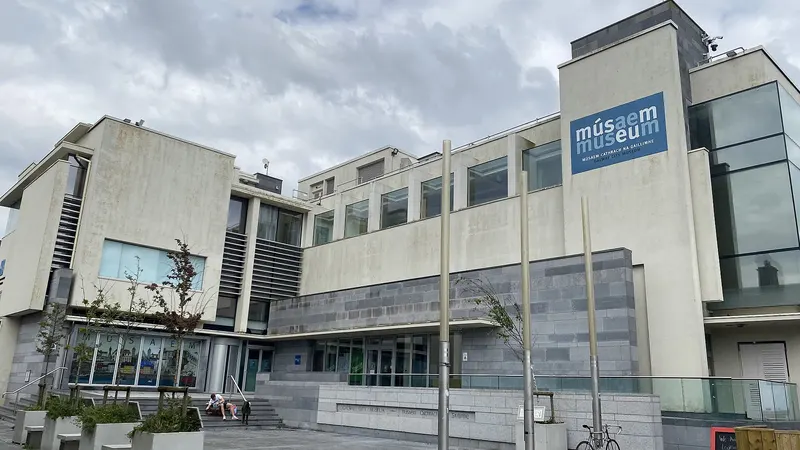 The glass and stone front of Galway City Museum beside the Spanish Arch