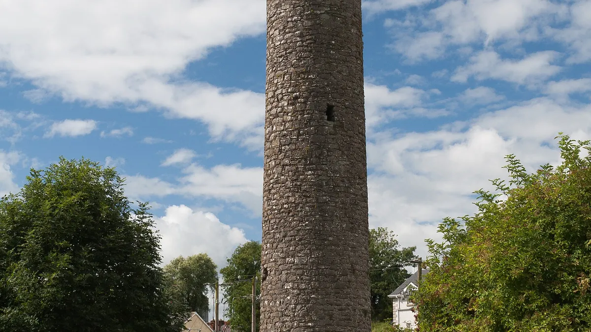 The round tower at Clones standing among the old gravestones