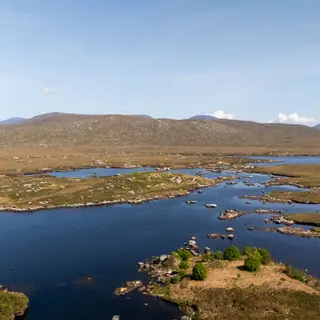The lakes and low hills of Connemara from the air under a clear sky