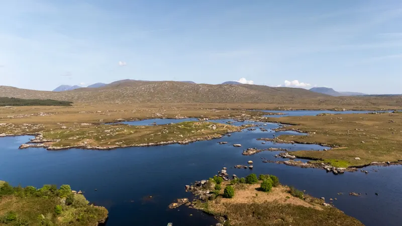 The lakes and low hills of Connemara from the air under a clear sky
