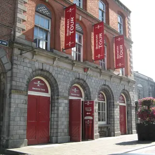 The brewery front at Smithwick's in Kilkenny with its red arched doors and banners