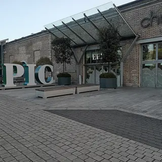The glass and brick front of the CHQ building with the EPIC letters outside it