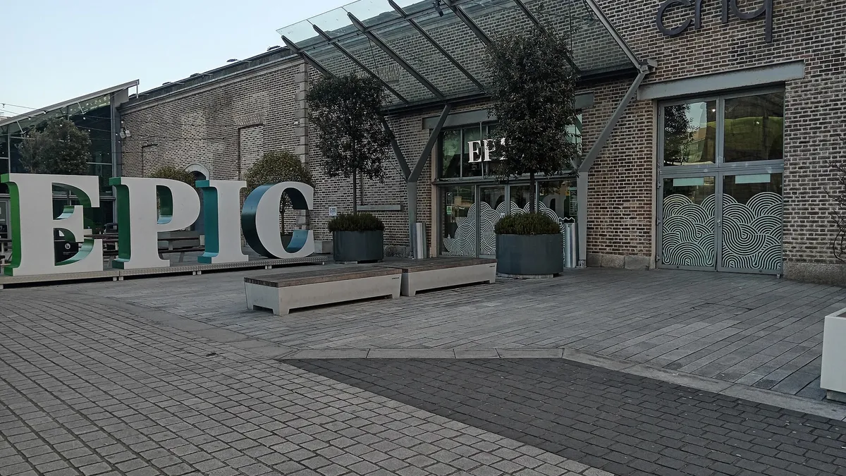The glass and brick front of the CHQ building with the EPIC letters outside it