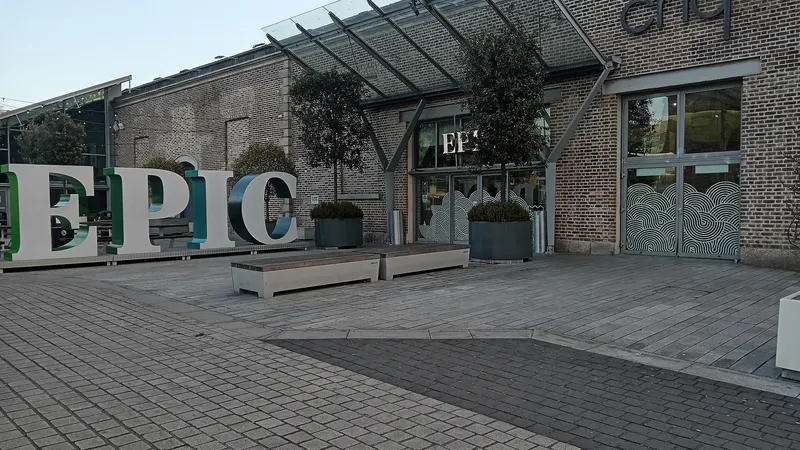 The glass and brick front of the CHQ building with the EPIC letters outside it