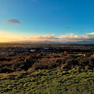 The view from Vinegar Hill at dawn out over the fields and the town below