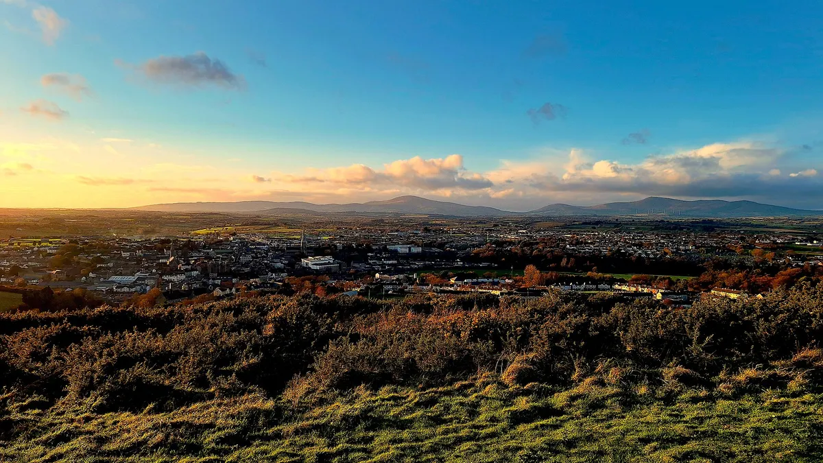 The view from Vinegar Hill at dawn out over the fields and the town below