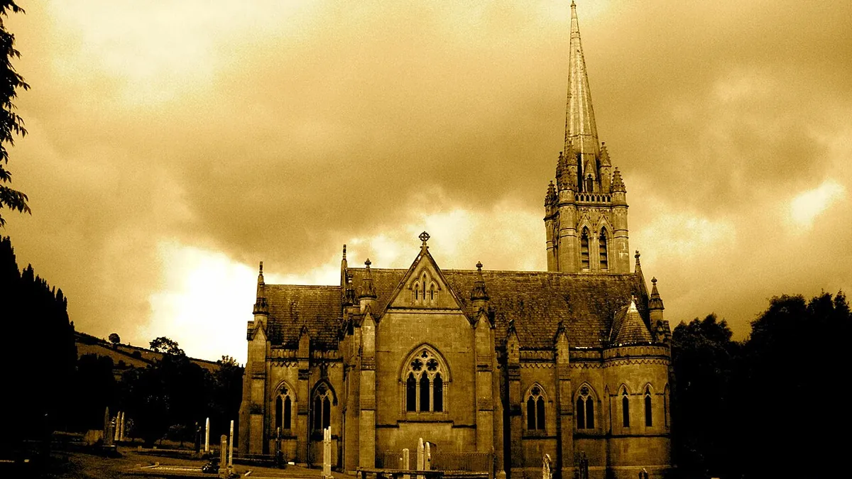 The Adelaide Memorial Church at Myshall silhouetted against a yellow evening sky