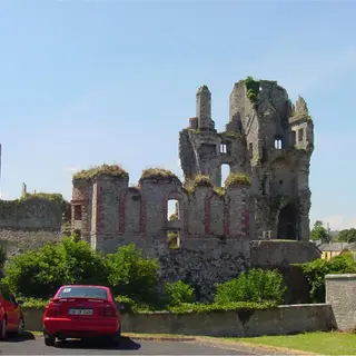 The broken towers and walls of Askeaton Castle above the village