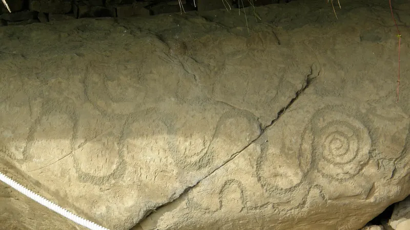 Spirals carved into the edge of a kerbstone at Knowth