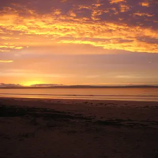 Sunset over the wide sands of Enniscrone Beach, County Sligo