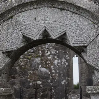 The carved Romanesque chancel arch inside the old church at Rahan