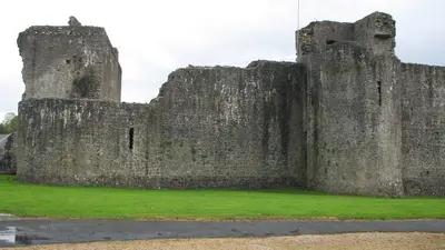 The thick curtain walls and corner towers of Ballymote Castle
