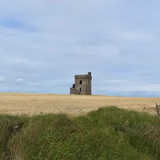 The old signal tower standing on the headland above the cliff walk at Ardmore