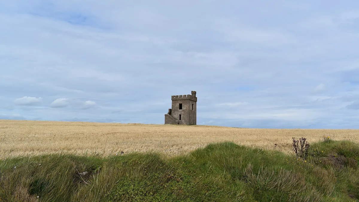The old signal tower standing on the headland above the cliff walk at Ardmore