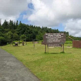 The path and the welcome sign at the entrance to Ards Forest Park