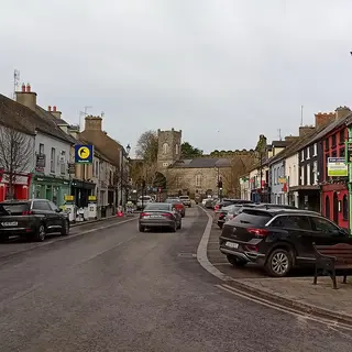 The wide main street of Thomastown running down to the old buildings at the end