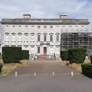 The long front of Castletown House at the end of its avenue, with scaffolding up on one wing