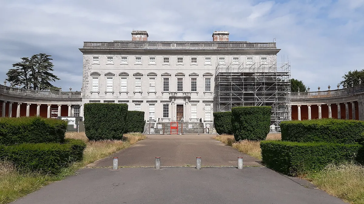 The long front of Castletown House at the end of its avenue, with scaffolding up on one wing