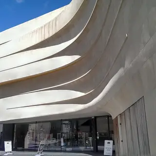 The curved white front of the Medieval Museum in Waterford