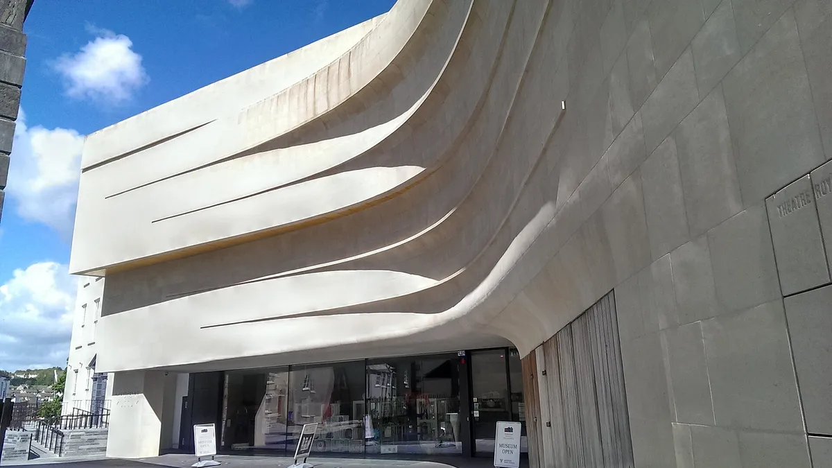 The curved white front of the Medieval Museum in Waterford