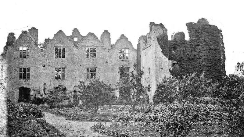 The roofless ruin of Athlumney Castle in black and white