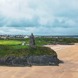 Ballybunion Castle on the cliff above the beach
