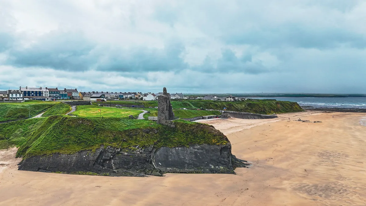 Ballybunion Castle on the cliff above the beach