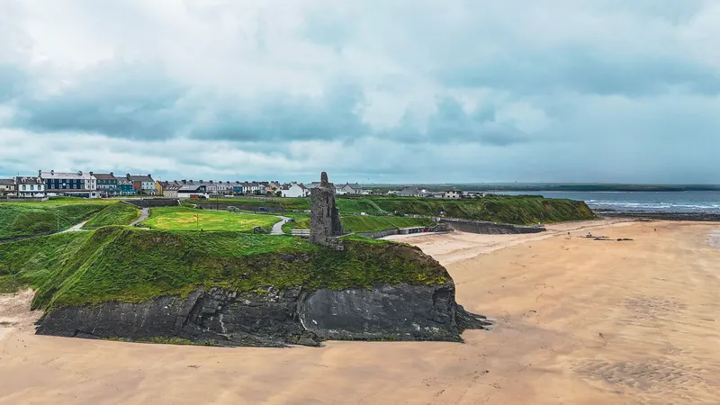 Ballybunion Castle on the cliff above the beach