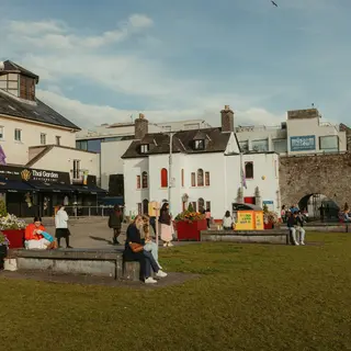 The Spanish Arch in Galway with the green and the buildings beside it