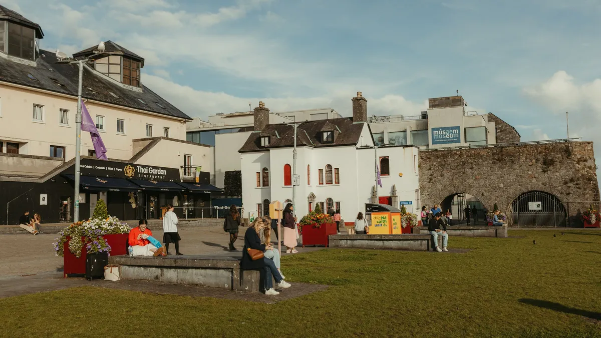 The Spanish Arch in Galway with the green and the buildings beside it