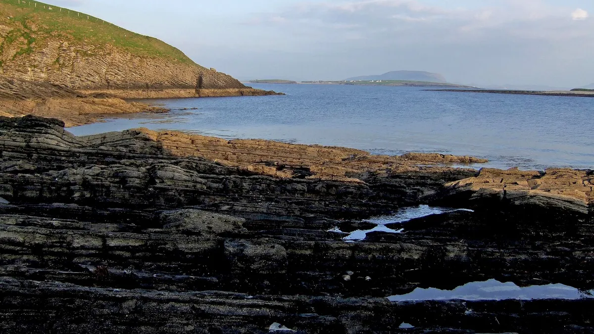 The rocky foreshore below Knocknarea with the mountain across the bay