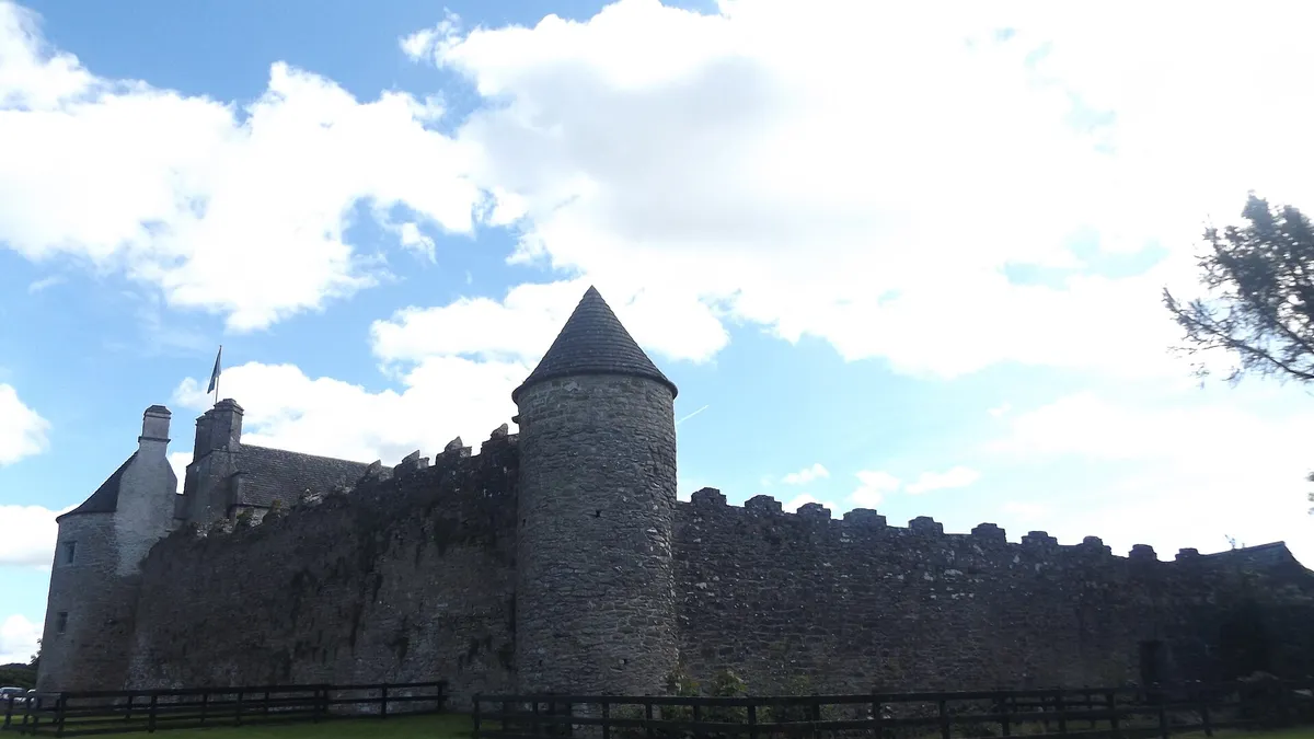 The round tower and curtain wall of Parke's Castle above Lough Gill