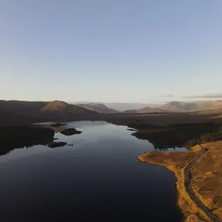 Lough Inagh holding the shadow of the mountains at sunset in Connemara