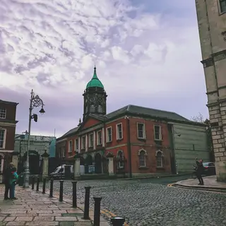 The courtyard at Dublin Castle with the clock tower at the end of it