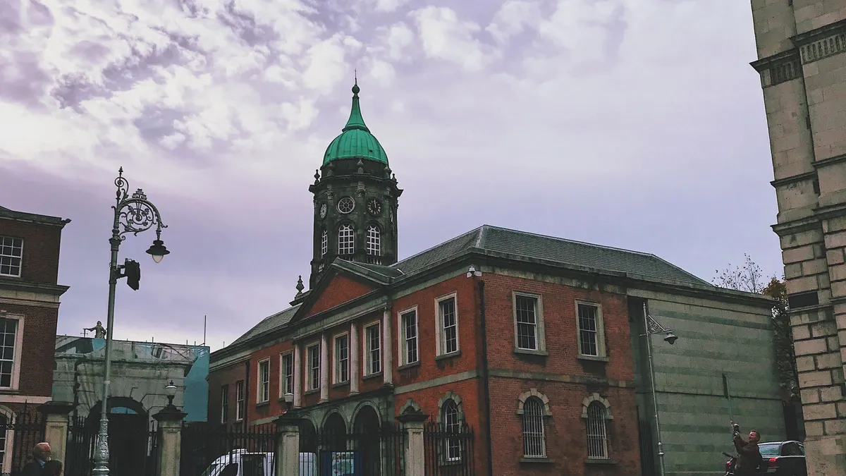The courtyard at Dublin Castle with the clock tower at the end of it