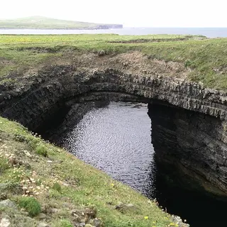 Seawater in the deep collapsed sea arch at the Bridges of Ross