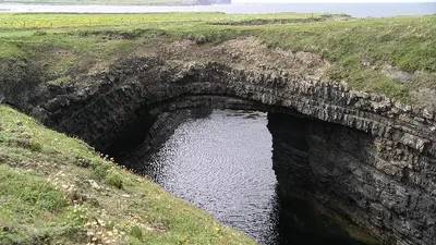 Seawater in the deep collapsed sea arch at the Bridges of Ross