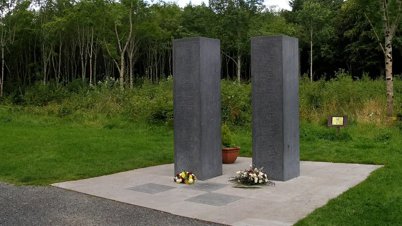 Two tall granite slabs standing on a paved square in Donadea Forest Park
