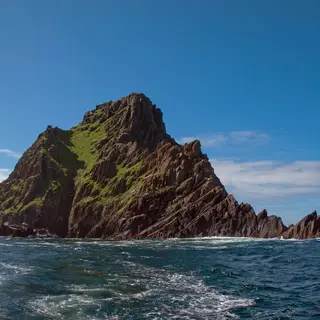 Skellig Michael rising out of the Atlantic under a clear sky